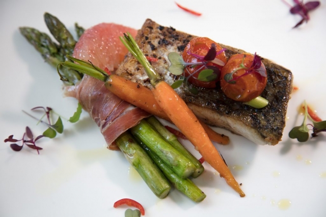 Barramundi on wrapped vegetables